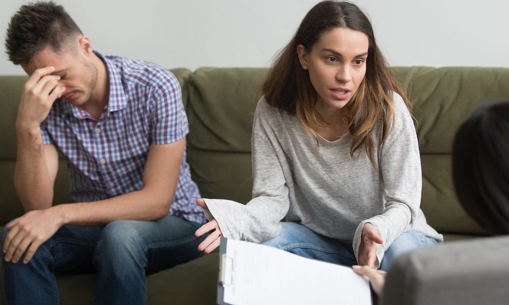 Unhappy frustrated woman sharing problems with counselor, couple counseling concept The couples therapist who rehabilitates love after brain injury