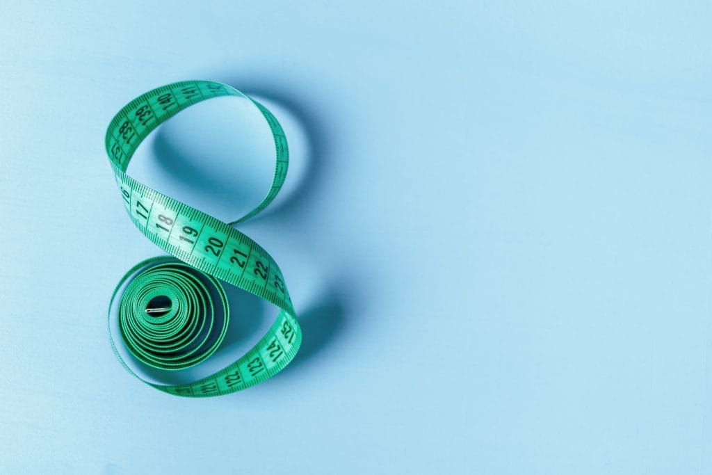 A blue measuring tape to mark a study on the effects of body weight on stroke and dementia