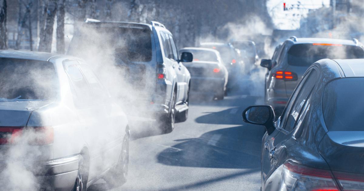 Air pollution flowing from the back of cars into the air