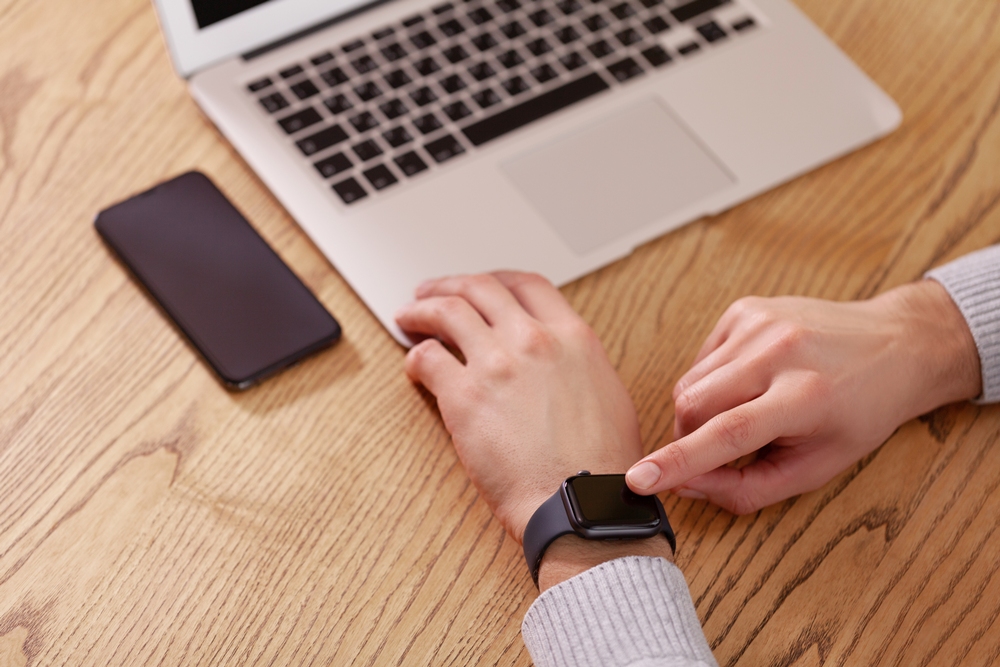 mens-hand-touching-watch-top-view-can-be-used-as-mock-up New Apple Watch feature helps track Parkinson’s tremor