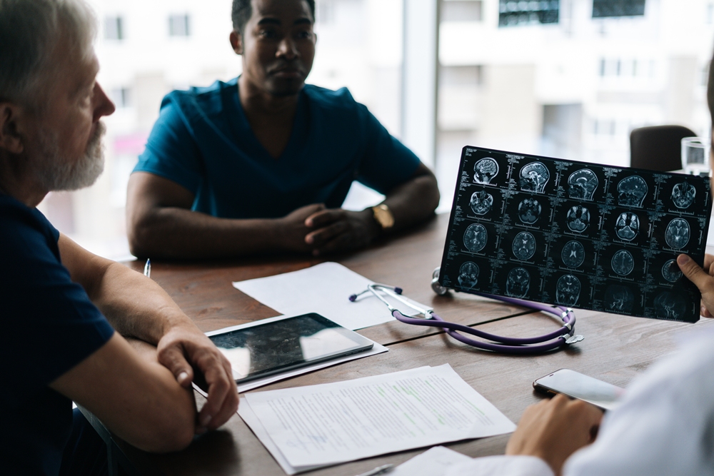 close-up-working-team-multi-ethnic-doctors-discussing-together-history-disease-patient-using-mri-scan-medical-conference-sitting-desk-light-hospital-office-near-window Gut bacterial compound may worsen brain injury after stroke