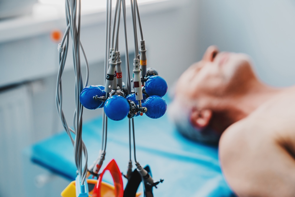 ECG electrodes with senior patient on background Human-centred AI: What neurorehabilitation stands to gain and guard against