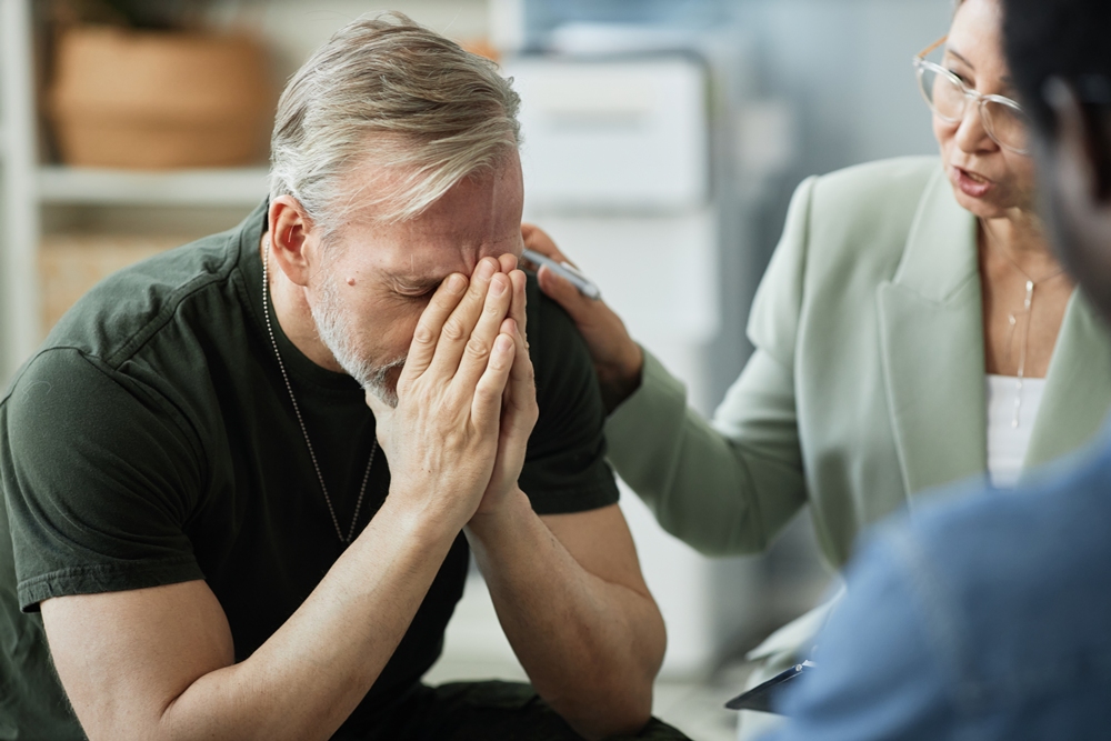 focus-grey-haired-man-covering-his-face-while-suffering-from-ptsd Initiative launched to improve emotional health of brain injury survivors