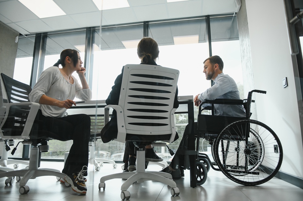 Group of young people in business meeting. £60 million fund open for bids to help disabled people into work