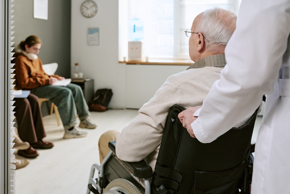 Senior Man with Disability Entering Medical Waiting Room with Doctor Brief, personalised rehab may ease cognitive difficulties in MS – study