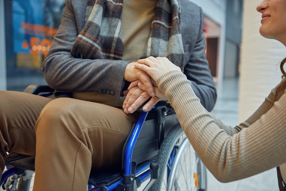 womanassistant-holding-mature-mans-hands-providing-caring-helping MS nonprofit raises US$12m on first day of US$1b campaign